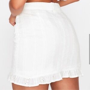 White lace miniskirt with ruffle detail